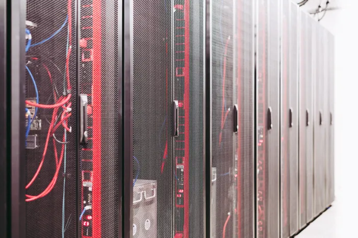 Modern data server room with network racks and cables